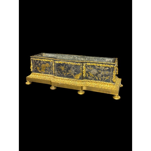 A Fine 19th Century French Gilt Bronze Chinoiserie Planter, Circa 1870–1890. Of rectangular form, the jardiniere is...