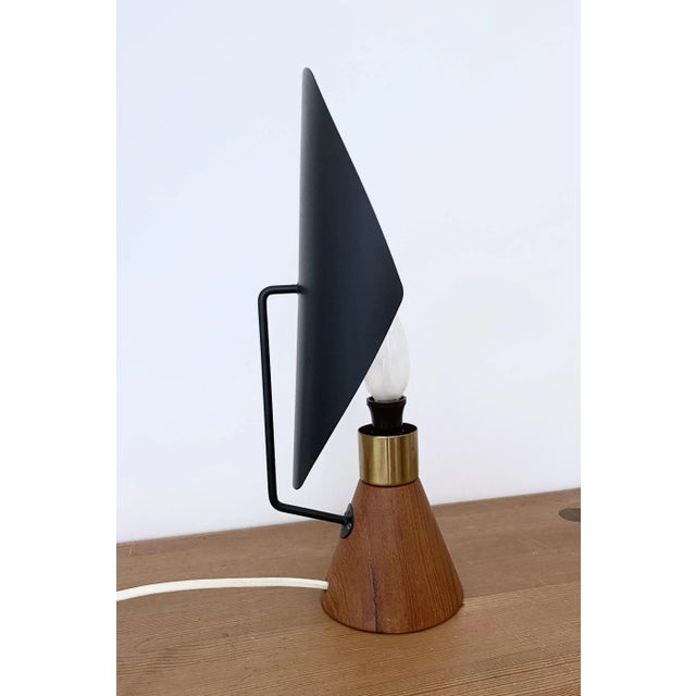 Rare Table lamp by Svend Aage Holm-Sørensen for ASEA, Sweden. Designed in the 1950s with a teak base and metal shade it...