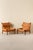 A pair of the very comfortable Inca chair in patinated brown original buffalo leather. Designed by Arne Norell, produced...