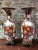 A monumental pair of japanese meiji period imari porcelain vases, with foliage bronze stands, dating from the late 19th...