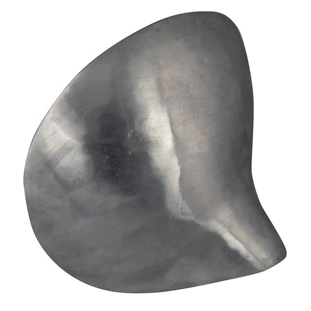 This metal alloy sculpture is a bold way to add interest to any decor. Small idiosyncrasies due to the artisan crafted...