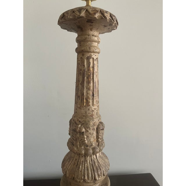 A beautifully crafted table lamp by Aidan Gray, featuring a classic column silhouette with richly carved detailing and a...