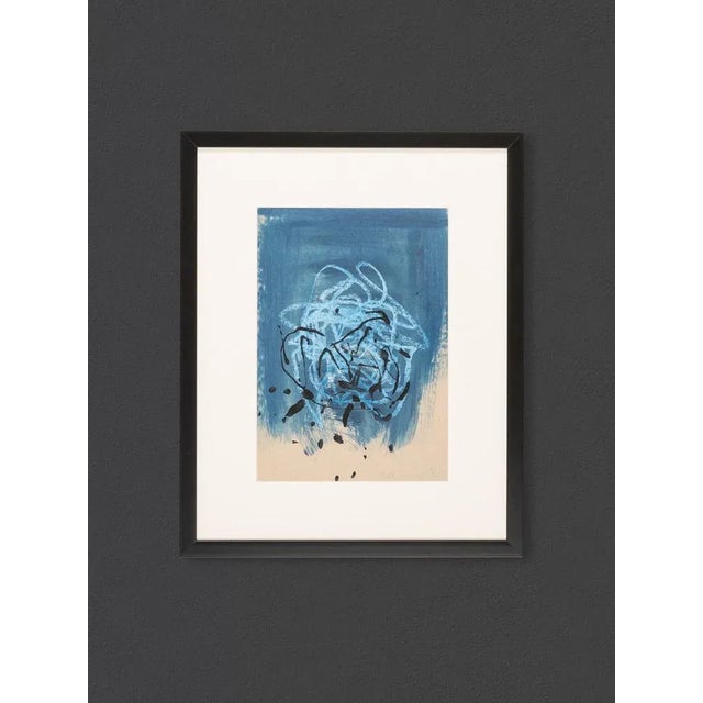 Abstract painting in different blue tones with black color sprinkler. Acrylic on paper. Hanging framed with passepartout...