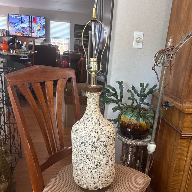 This is a very nice bottle-shaped cork lamp. It has a wonderful Mid Century vibe.