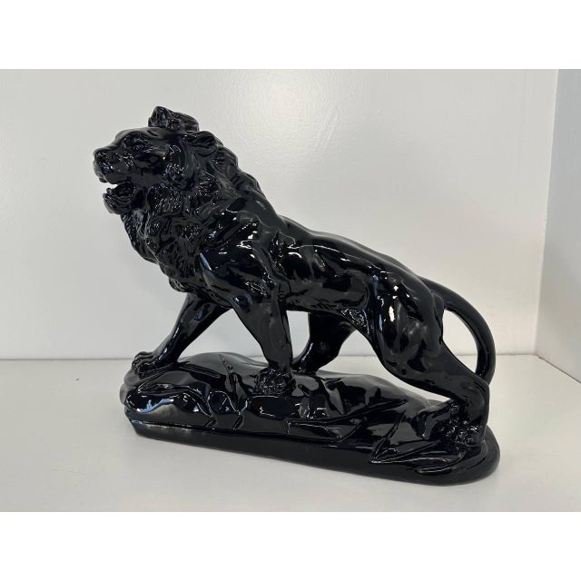 This Art Deco fired clay lion was produced in Italy in the late 1930s. Completely black polished.
