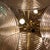 Italian design, Mid Century. Large ceiling lamp with a gilded brass structure and a fixed Sputnik-style bar that...