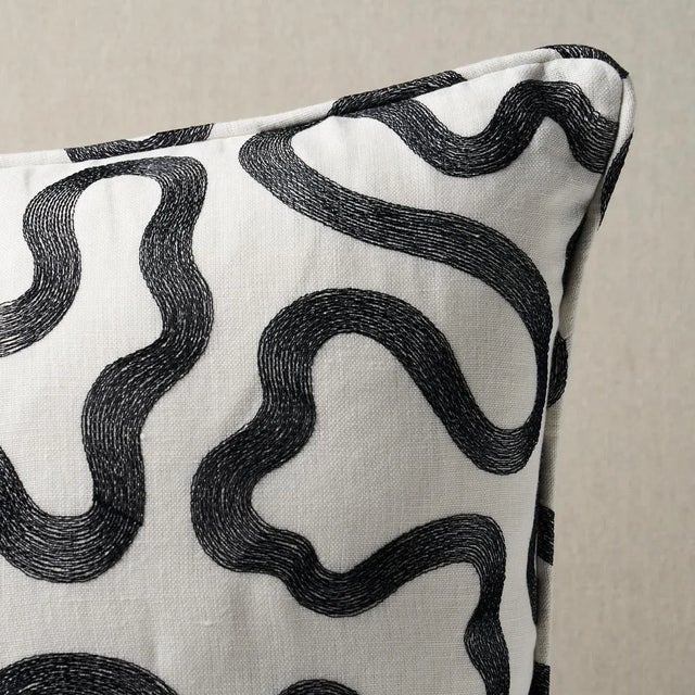 This pillow features Riley Embroidery with a self welt finish. A modern take on a classic vermicelli pattern, Riley...