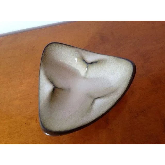 A Mid-Century California pottery piece hand thrown by noted designer, Rupert Deese. Signed.
