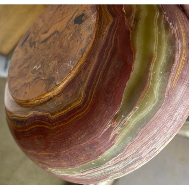 This amazing bowl with its deep red juxtaposed with brown and green is a head turner. When held to light the green becomes...