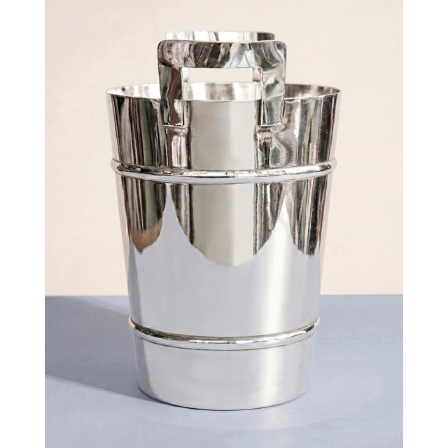 Gracefully designed vintage mid-century silver-plated wine or champagne cooler and ice bucket. Bearing marks on the...