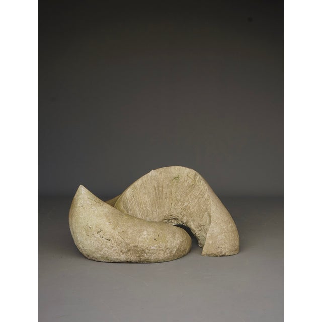 A large abstract sculpture made to go into a garden as decorative art object. It is made of case concrete (hollow inside)....
