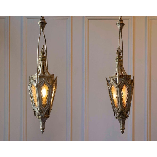 English Gothic Revival painted iron single-light lanterns from the 19th century, priced and sold per pair. Two pairs are...