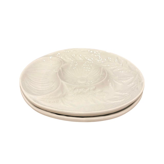 A lovely pair of vintage artichoke plates. Each features a glossy white ceramic finish with raised decorations. Made by...