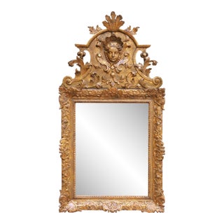 18th Century French Regence Carved Giltwood Wall Mirror With Cherub Crest For Sale