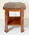 A fine English side table or occasional table from the Art Deco period, featuring an octagonal table top over a low shelf...