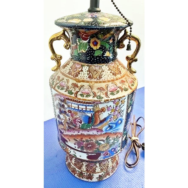 Japanese Satsuma style moriage lamped vase, Samurai style Here's a 20c. Japanese vase turned lamp, decorated with a thick,...