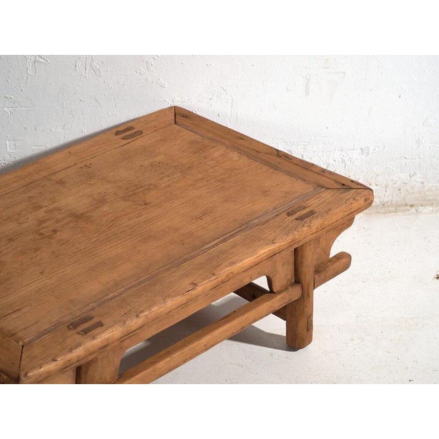 Antique low table in pine wood, traditional chinese furniture originating from northern china and dated circa 1930....