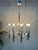 Large vintage designer chandelier by sciolari. 10x e14 light points on chrome tubes. Marked. Electrical wiring has been...