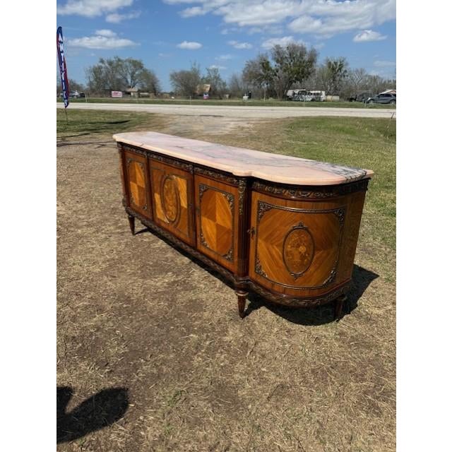 a Long Spectacular French antique Louis XVI Demilune sideboard made of mahogany with Floral inlay Parquetry. The wood has...