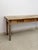 This substantial vintage Nadeau Indonesian solid wood console table is a beautifully crafted and characterful entryway or...