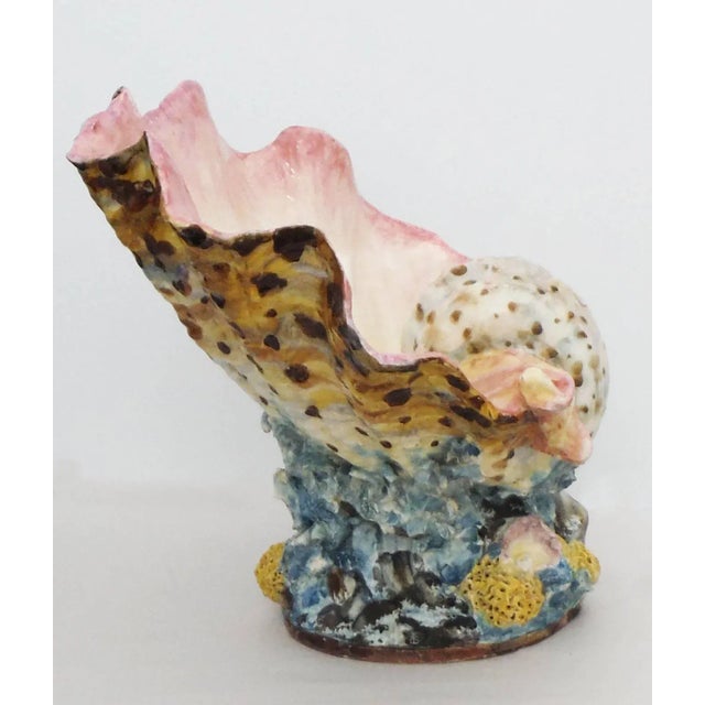 Stunning monumental Majolica pink clamshell jardiniere vase with coral, seaweeds and yellow sponges. This piece will add...