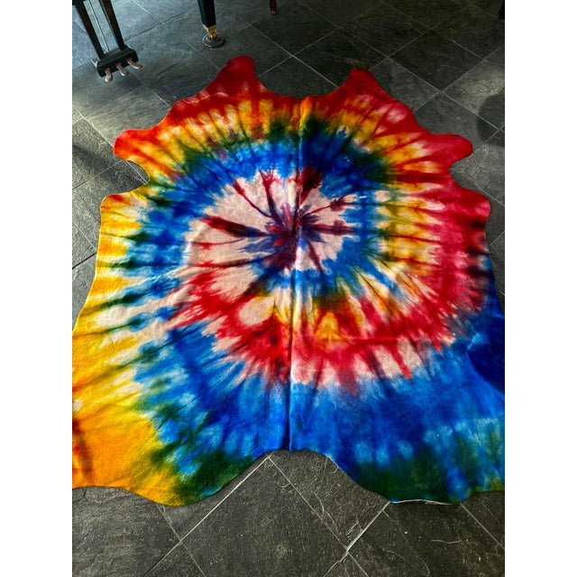 Fabulous natural Brazilian cowhide that has been tie-dyed to create a statement rug for any space. Brazil is the beef...