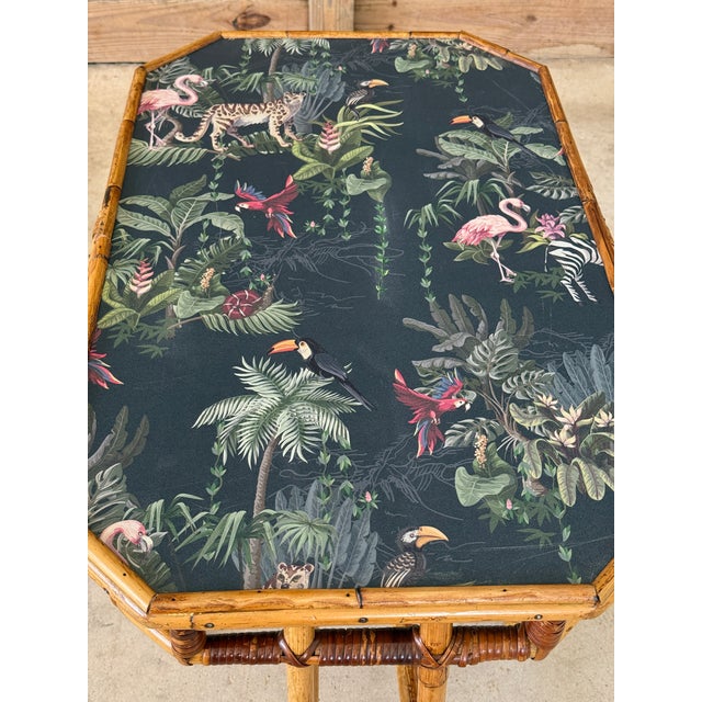 A fabulous and highly decorative mid-20th century rattan side table by Sons-Cunningham of New York, reimagined with a bold...