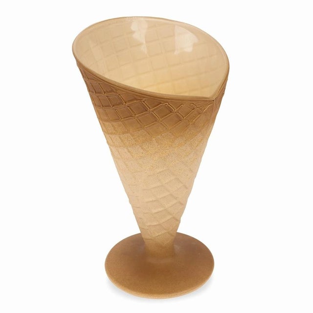 A glass ice cream bowl made by the Italian company Bormioli Rocco in the 1970s. The glass has a smooth glossy finish on...