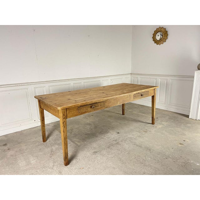 Fully cleaned and restored in our workshops, this vintage 1920s table with a pine top and oak legs boasts soft, simple...