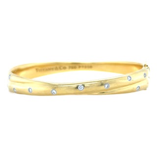 Late 20th Century Tiffany & Co. Etoile 18k Yellow Gold, Platinum and Diamond Bangle Bracelet For Sale