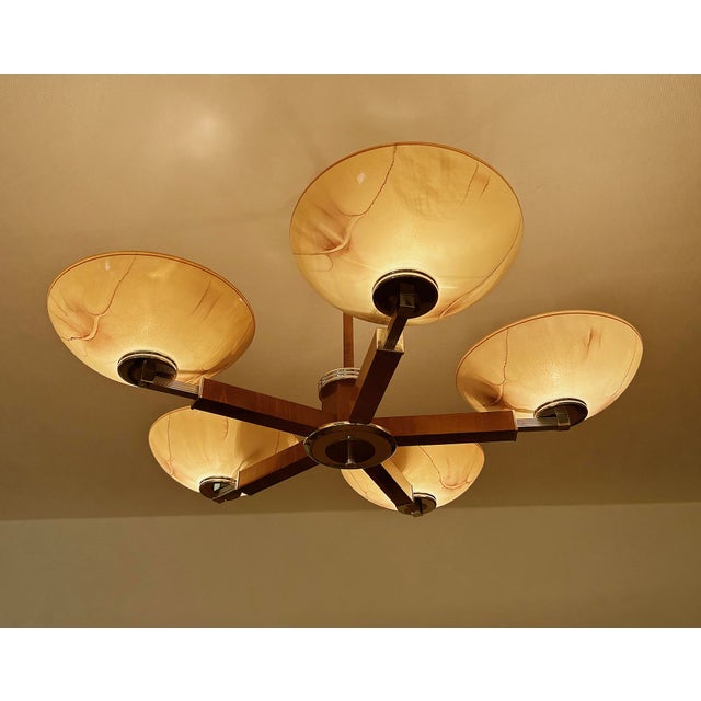 large Art Deco pendant light from the 1930s, fully rewired, featuring a wood structure with chrome trim, 5 spokes with...