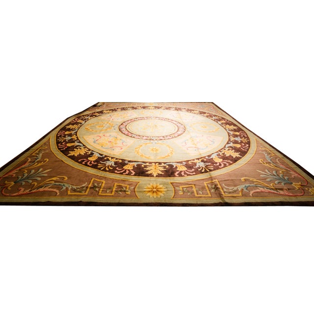"This majestic Antique French Savonnerie rug, dating to circa 1820, is a palatial-sized masterpiece of European textile...