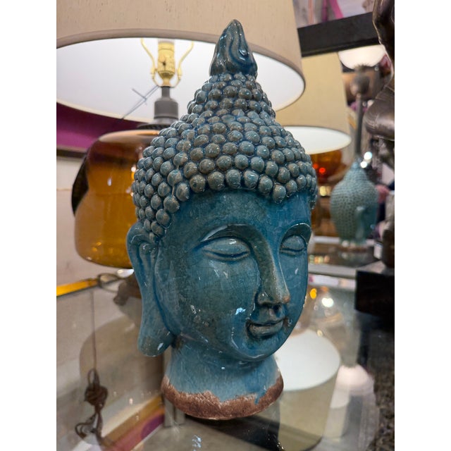 Teal blue crackle glaze Buddha. Beautiful natural details with clear crackle effect adding depth and history to this...