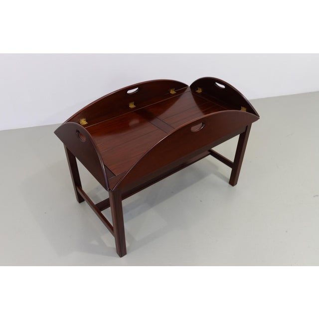 English Mahogany and Brass Butler's Tray Coffee Table, 1960s. Twentieth century "Butler's Tray" table in solid mahogany...
