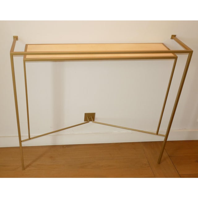Gold-patinated metal frame with a sycamore shelf. Secure with two concealed screws. Once the shelf is in place, screw the...