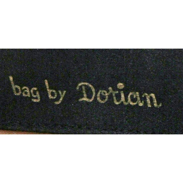 This purse is a rare one indeed. The leather has a very subtle texture in a criss-cross design that gives this purse the...