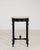 A piece whose travertine top, black carved leaf-motif leg gives it real character at first glance. It was made in France...