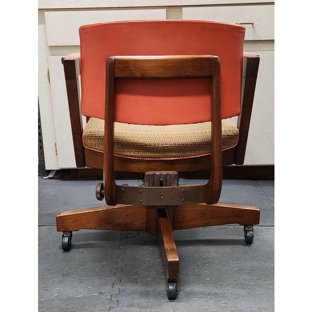 Vintage W.H. Gunlocke Chair Company mid-century modern desk chair with arms in a burnt orange naugahyde, tweed seat, heavy...