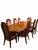 An elegant nine-piece dining set featuring a richly figured wood dining table and eight coordinating high-back chairs. The...