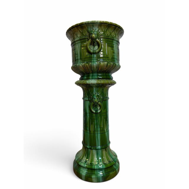 A striking and exceptionally well-preserved Arts & Crafts period majolica jardiniere and pedestal set, manufactured by the...