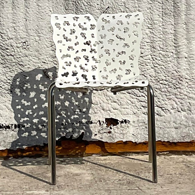 This vintage contemporary cutout chair, inspired by Richard Schultz, features a sleek, modern design with a unique cutout...