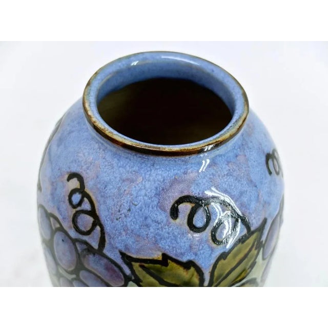 Unique vase made of glazed ceramic. Beautiful glaze in blue tones with hand -painted vines and grapes. Stamped several...