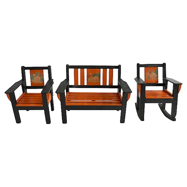Set of three 1930s miniature wood handmade furniture pieces. Original black and orange paint with floral decals....
