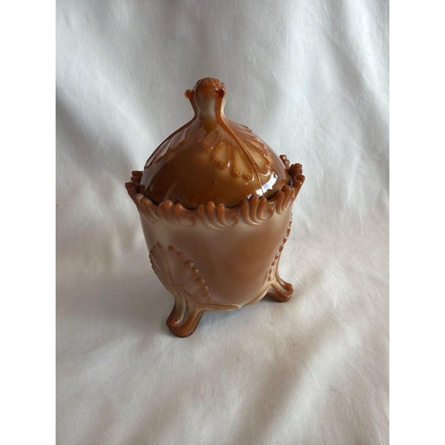 Antique Greentown Chocolate Slag Glass Sugar Bowl, Leaf and Bracket pattern, footed with original lid. This stunning piece...