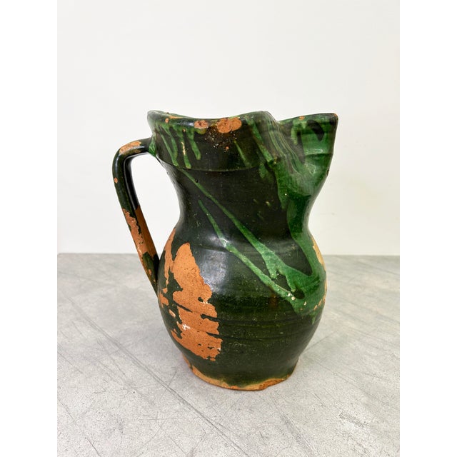 An antique jug in a unique glaze with wonderfully exaggerated proportions. Wine and water jugs from Puglia usually have...