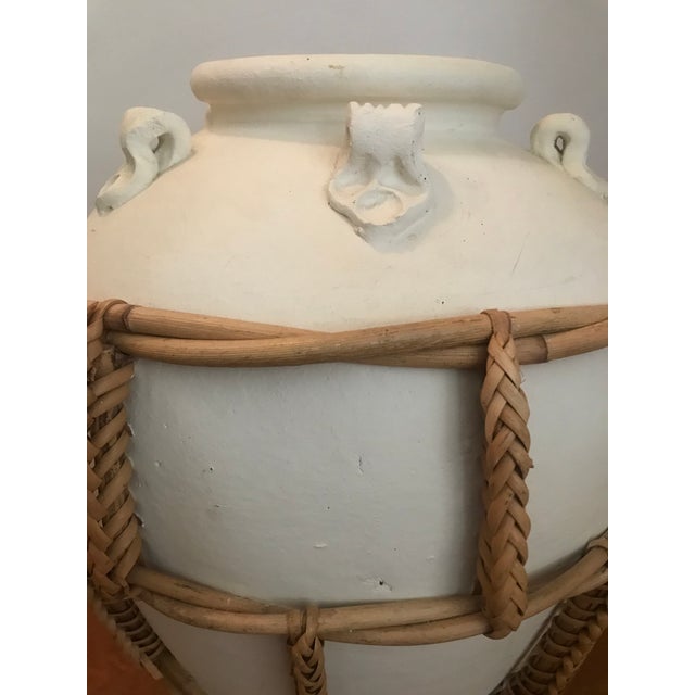 Large, braided rattan wrapped pottery vase. Beautiful boho style, would also be great made into a lamp.