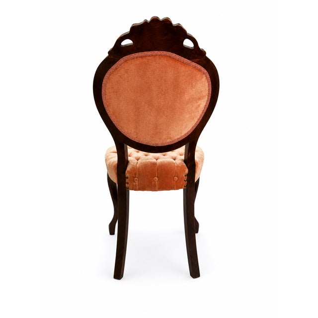 This elegant vintage side chair features a beautifully carved solid wood frame with a hand-carved floral crest, graceful...