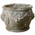 A 19th-century English cast stone planter with classic design elements. The exterior of the pot is adorned with swags of...