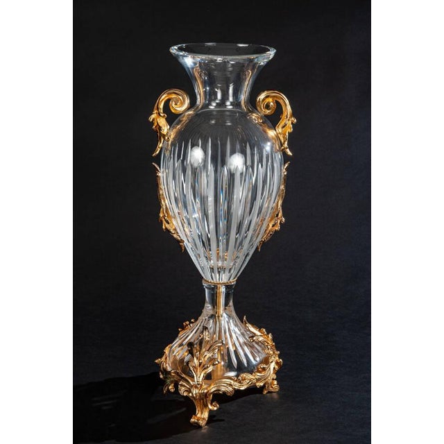 Sculpted from brilliant clear Italian crystal, this vase features graceful vertical fluting and a classically curved...