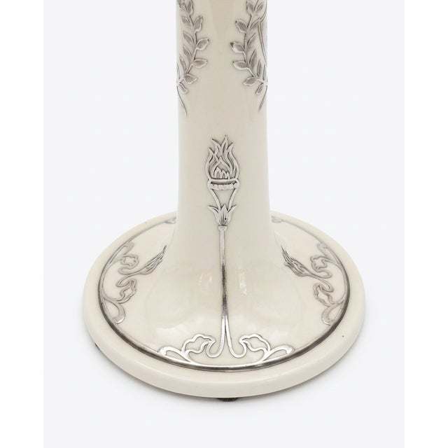 This exquisite pair of Lenox Belleek porcelain candlesticks feature a stunning hand-applied sterling silver overlay in an...
